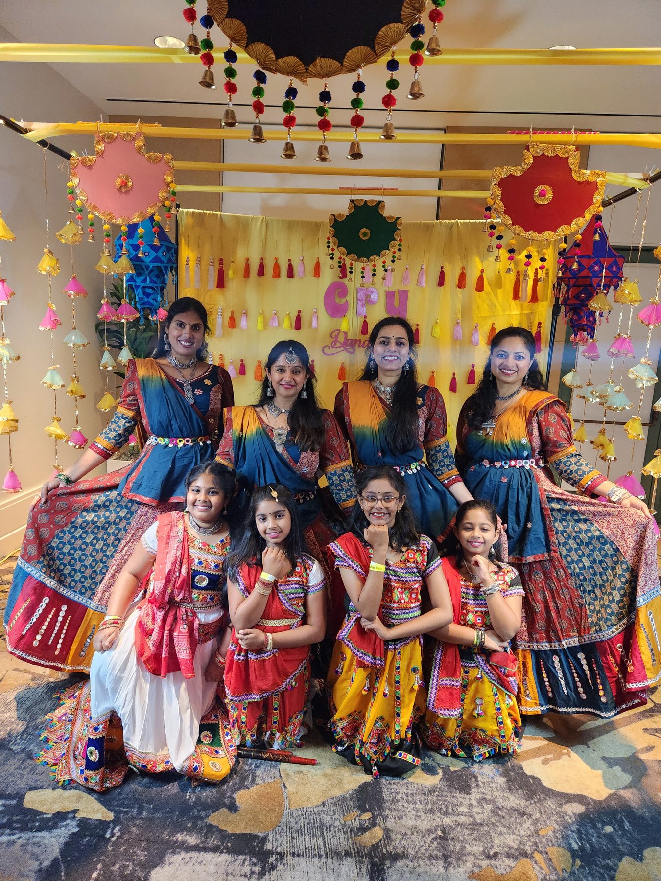 Dancers performing Garba and Dandiya in colorful traditional costumes