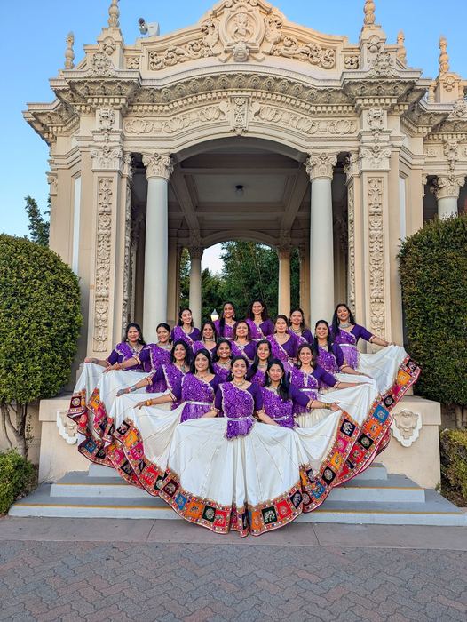 Group photo with skirts fanned out at Balboa Park pavilion