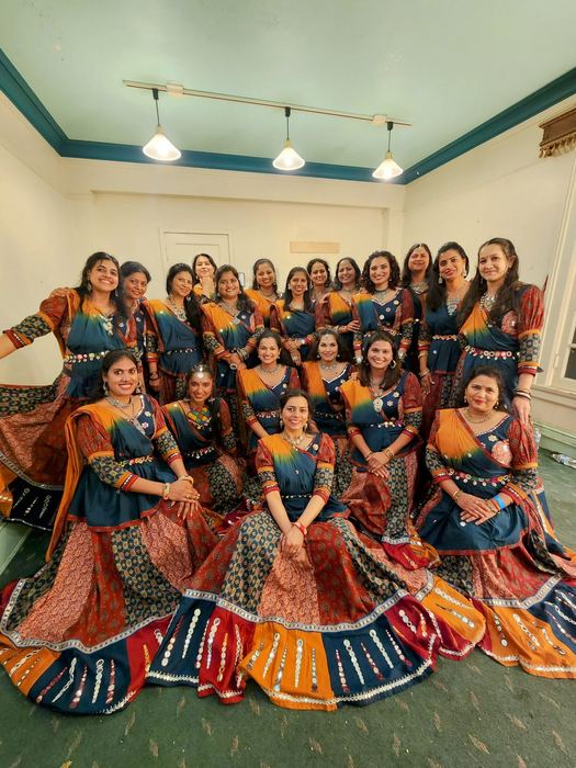Large group photo indoors after a performance