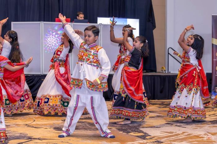 Young dancer performing in traditional outfit