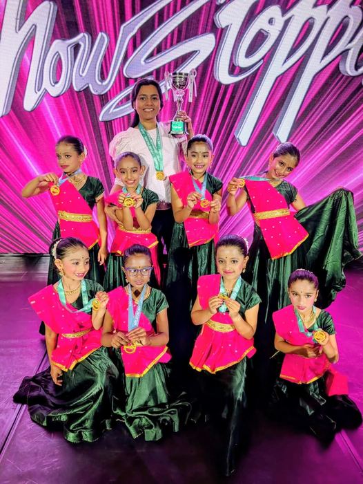 Kids team with medals and trophy at a competition