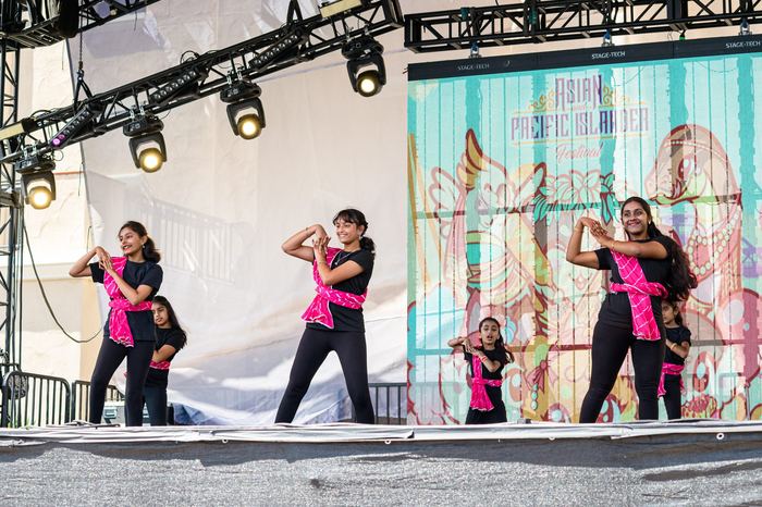 Kids performing on stage at a festival