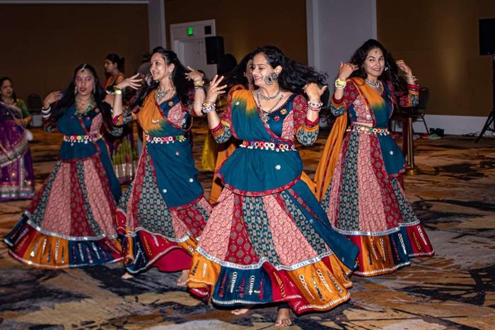 Group performing indoors, alternate angle